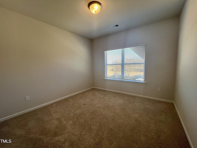 unfurnished room featuring carpet flooring