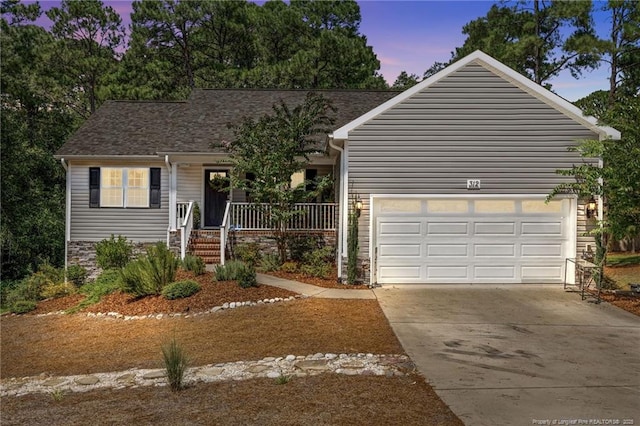 view of front of house with a garage and covered porch