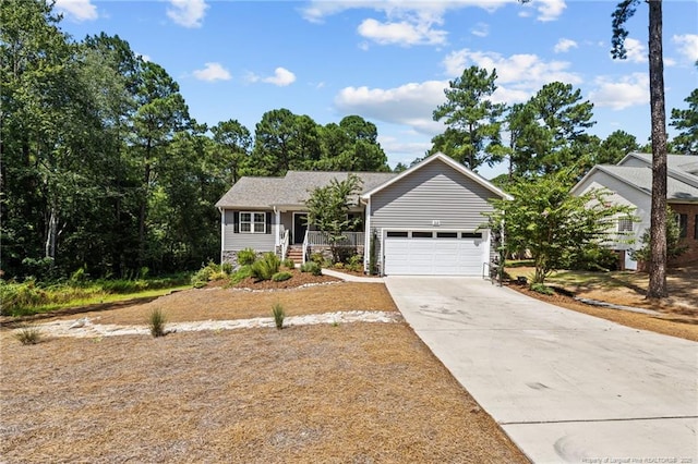 ranch-style house with a porch and a garage