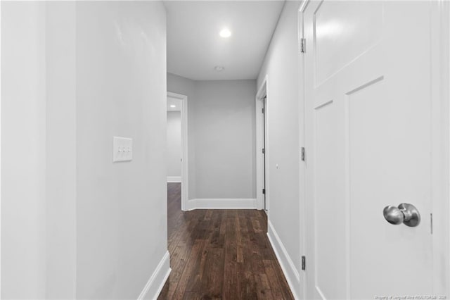 corridor featuring dark hardwood / wood-style floors