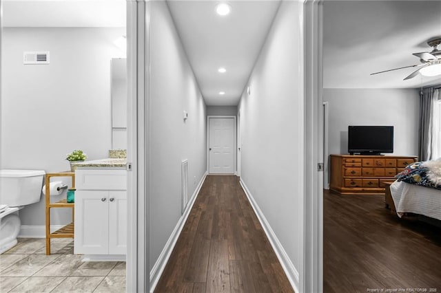 corridor featuring hardwood / wood-style floors