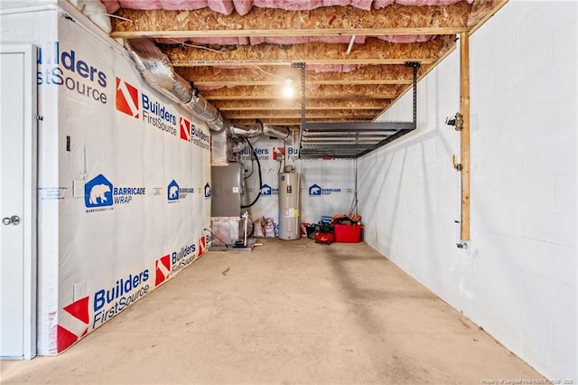 basement featuring heating unit and water heater