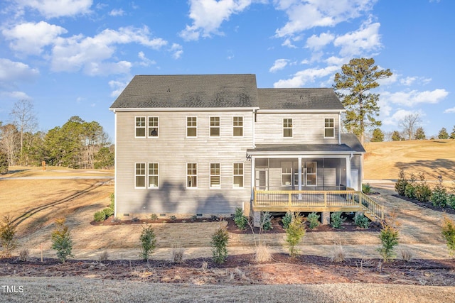 rear view of property with crawl space and a sunroom