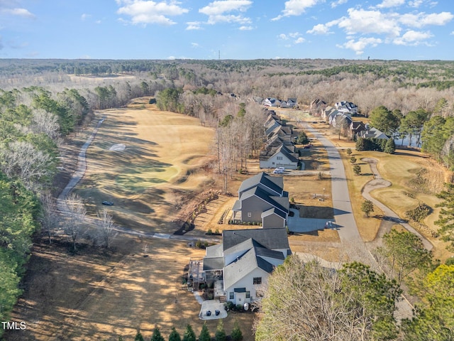 drone / aerial view featuring a forest view