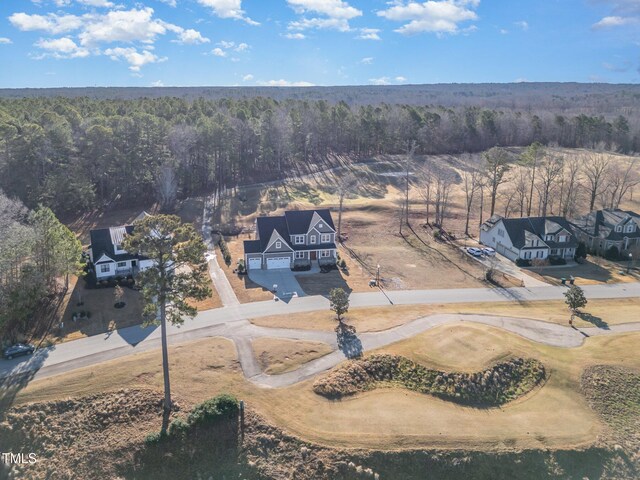 aerial view with a wooded view