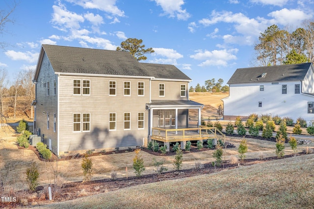 back of house with central AC and a sunroom