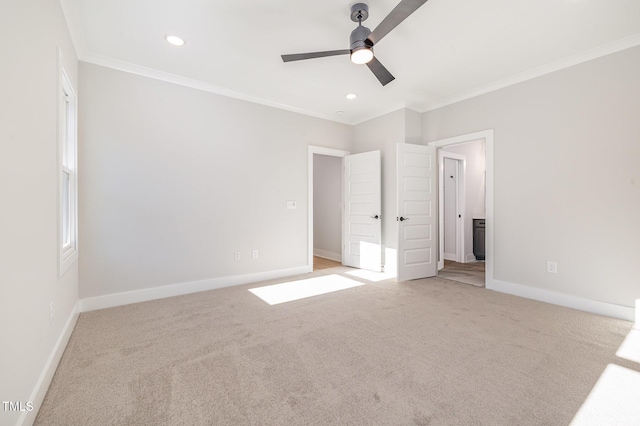 unfurnished bedroom featuring carpet floors, recessed lighting, crown molding, and baseboards