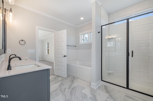 full bath with a sink, marble finish floor, a shower stall, a bath, and crown molding