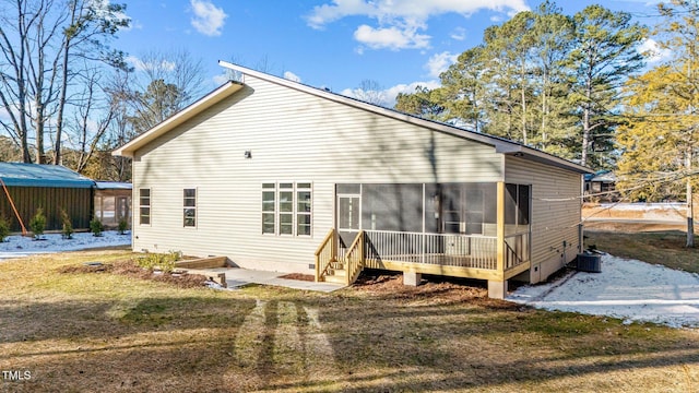 back of property with crawl space and a sunroom