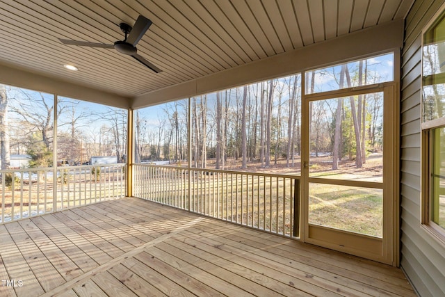 unfurnished sunroom with a ceiling fan