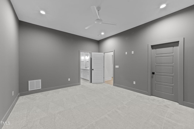 empty room with carpet floors, visible vents, ceiling fan, and baseboards