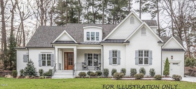 view of front of house featuring a front yard, a garage, and a porch