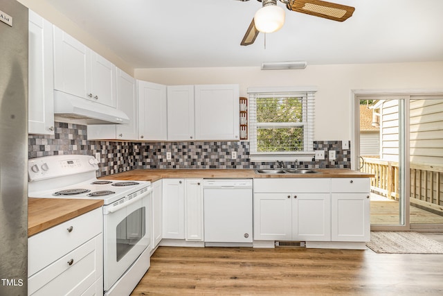 kitchen featuring light wood-type flooring, white appliances, sink, butcher block countertops, and ceiling fan