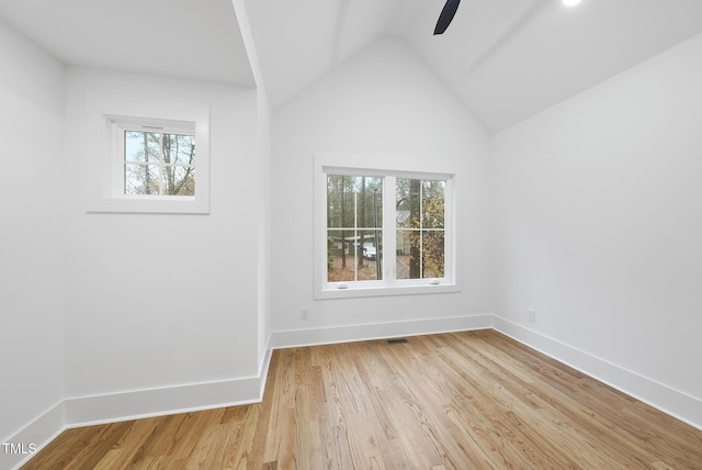 unfurnished room with light wood-type flooring, visible vents, and baseboards