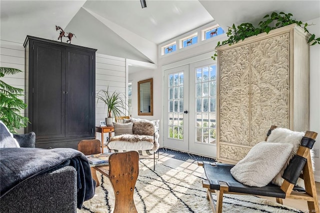 interior space with lofted ceiling and french doors