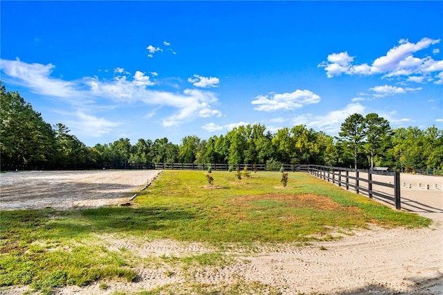 view of yard with a rural view