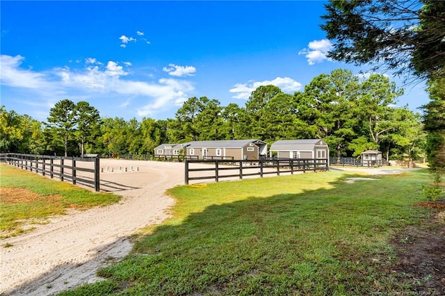 exterior space featuring a yard and a rural view