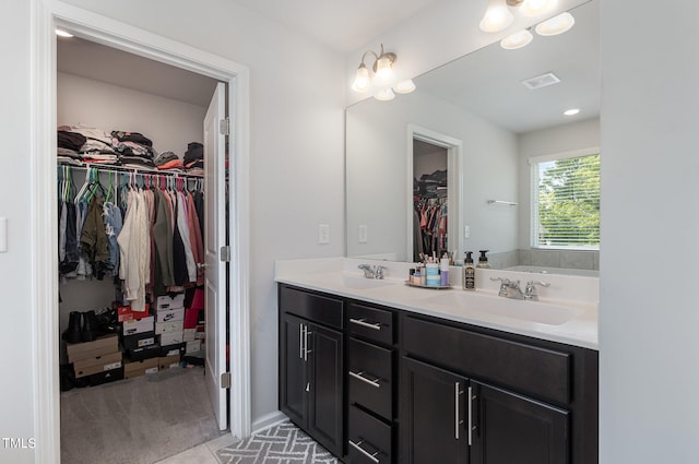 bathroom with vanity and a bathtub