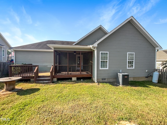 back of property with central air condition unit, a lawn, and a deck