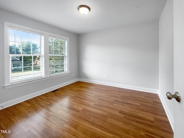 empty room featuring hardwood / wood-style flooring