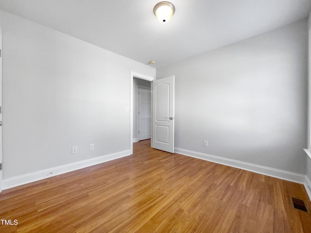 spare room featuring light hardwood / wood-style floors