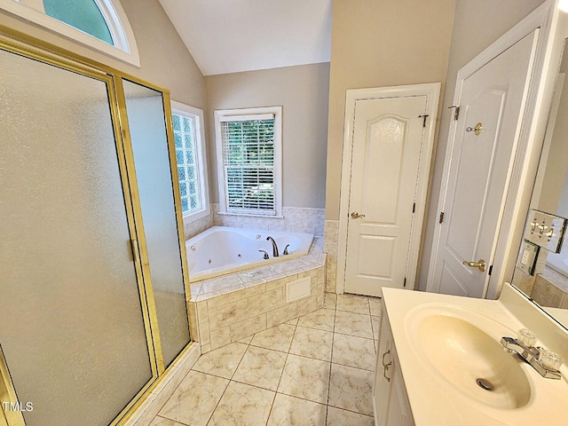 bathroom featuring tile patterned flooring, vanity, vaulted ceiling, and shower with separate bathtub