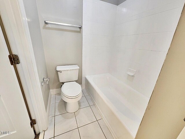 bathroom with tile patterned flooring and toilet