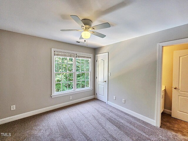 carpeted empty room with ceiling fan