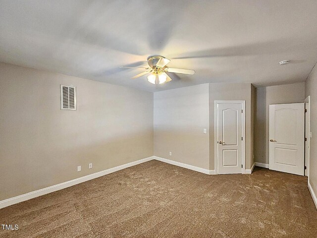 carpeted empty room featuring ceiling fan