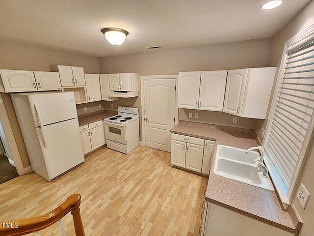 kitchen with light hardwood / wood-style flooring, sink, white appliances, and white cabinetry