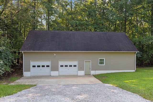 garage with a yard