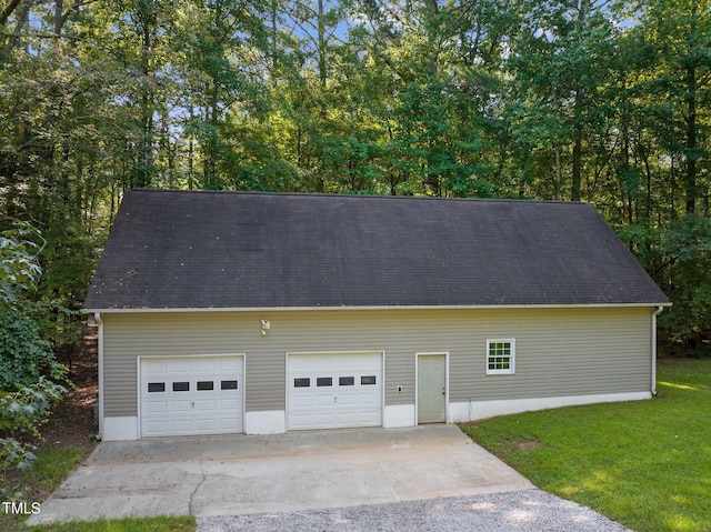 garage with a yard