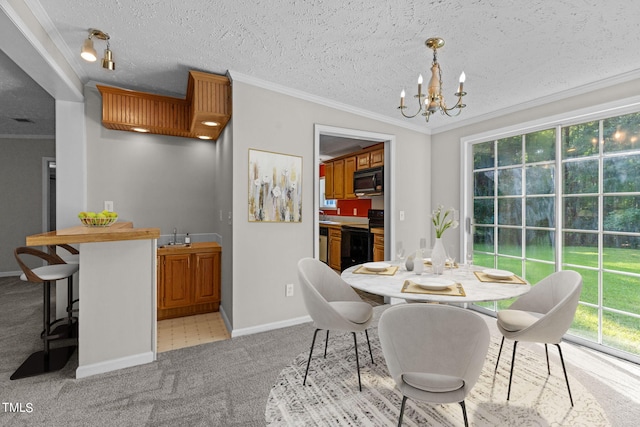 dining area featuring ornamental molding, a textured ceiling, a chandelier, and light colored carpet