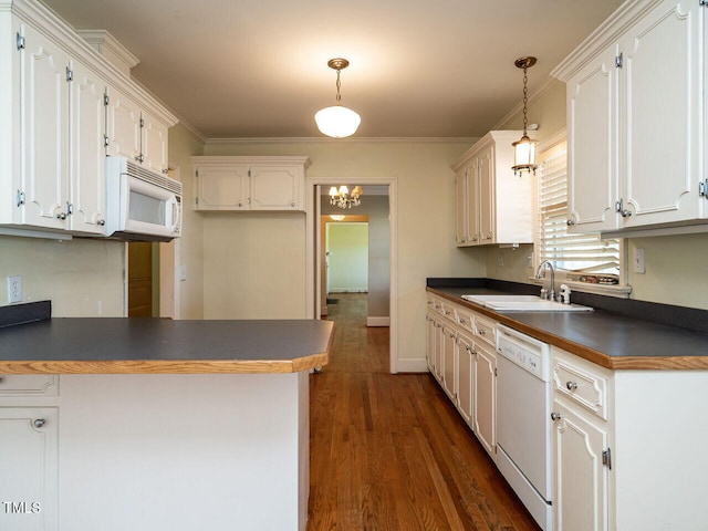 kitchen with sink, pendant lighting, white cabinets, white appliances, and dark hardwood / wood-style flooring