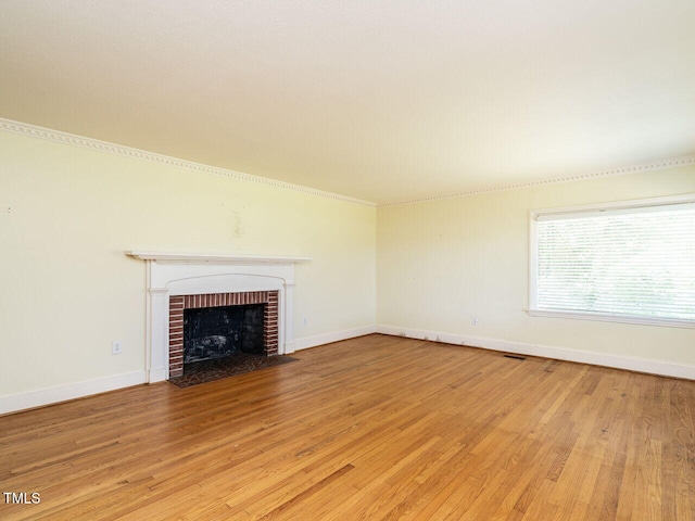 unfurnished living room featuring light hardwood / wood-style flooring and a fireplace