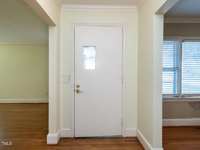 foyer featuring crown molding and wood-type flooring