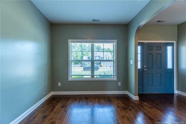 entryway with dark hardwood / wood-style flooring