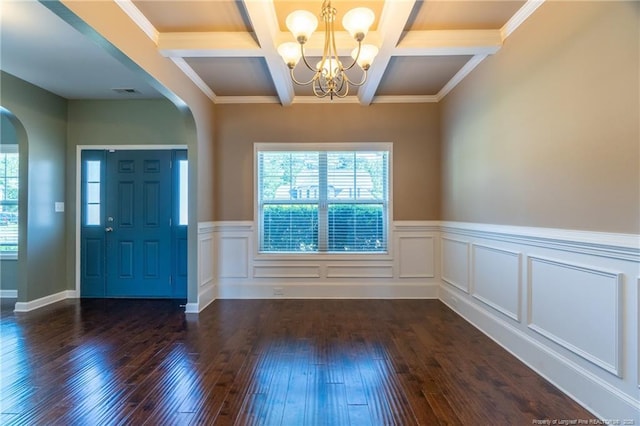 foyer entrance featuring coffered ceiling, an inviting chandelier, crown molding, dark hardwood / wood-style floors, and beamed ceiling