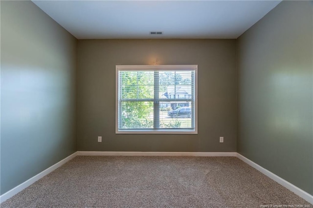 empty room featuring carpet floors