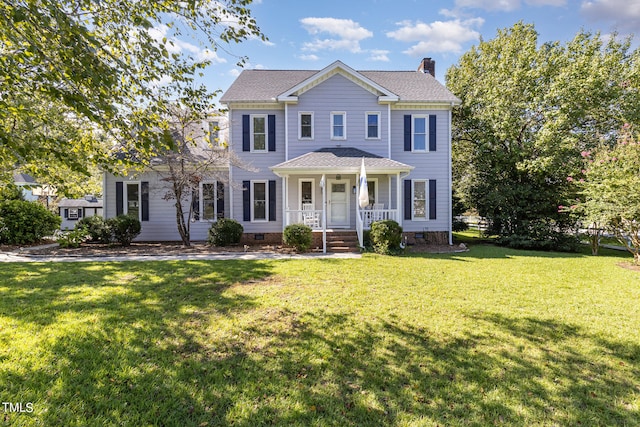 colonial home featuring a front lawn and a porch