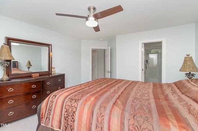 bedroom featuring ensuite bathroom, ceiling fan, and light carpet