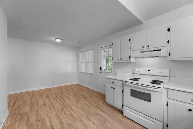 kitchen featuring white electric range oven, a textured ceiling, light wood-type flooring, and white cabinets