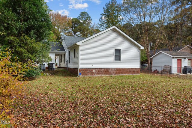 view of home's exterior with a yard