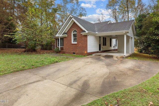 view of property exterior featuring a yard and a carport