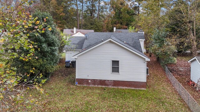 view of property exterior with a yard