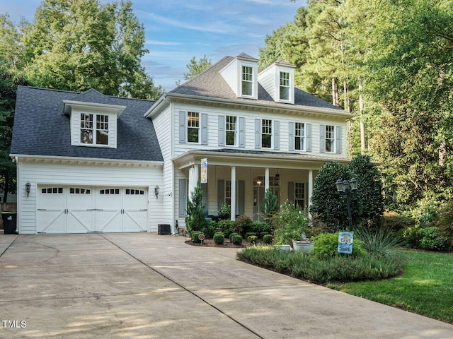 view of front of house featuring covered porch and a garage