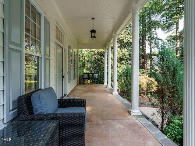 view of patio featuring a porch