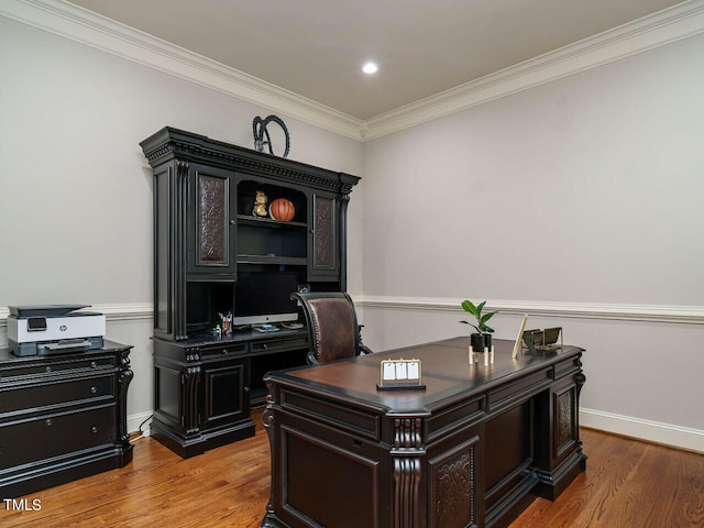 office with ornamental molding and light hardwood / wood-style flooring