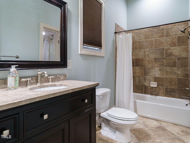 full bathroom with vanity, toilet, and shower / tub combo with curtain