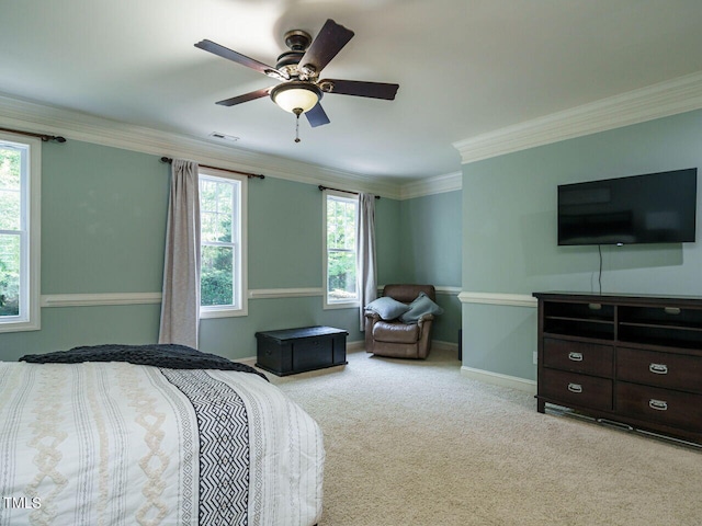 bedroom featuring light colored carpet, ceiling fan, and ornamental molding